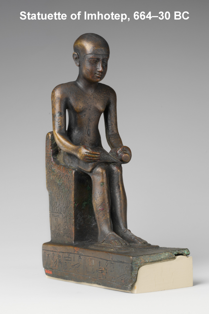 Bronze statuette of Imhotep, the first doctor in history, seated holding a papyrus scroll inscribed with hieroglyphs